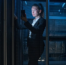 IT professional lady standing in server room